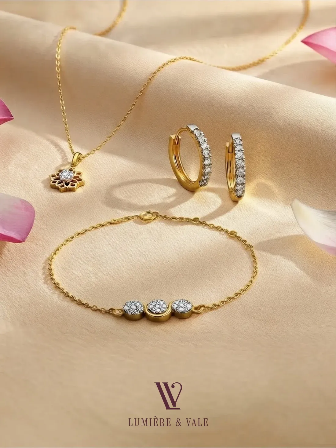 Gold pendant, diamond hoops and a tennis bracelet on champagne silk